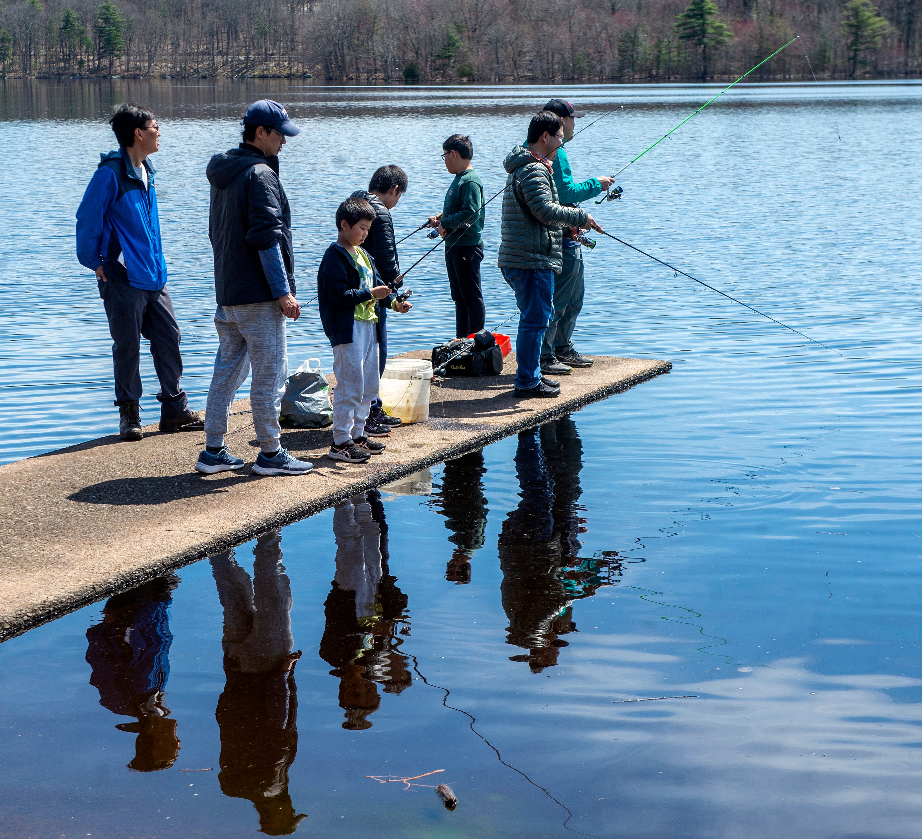 Many anglers tested their luck at Hopkinton State Park after Mass Wildlife released 400 brown trout into Hopkinton Reservoir, April 17, 2024.